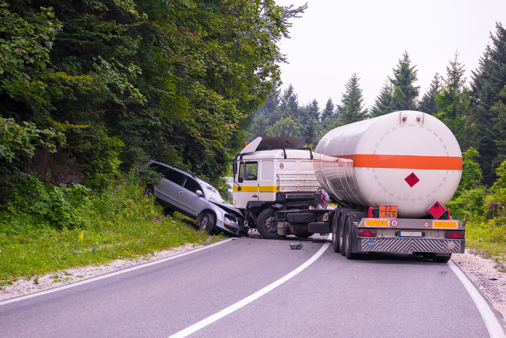 Truck and car accident blocking a beautiful scenic road